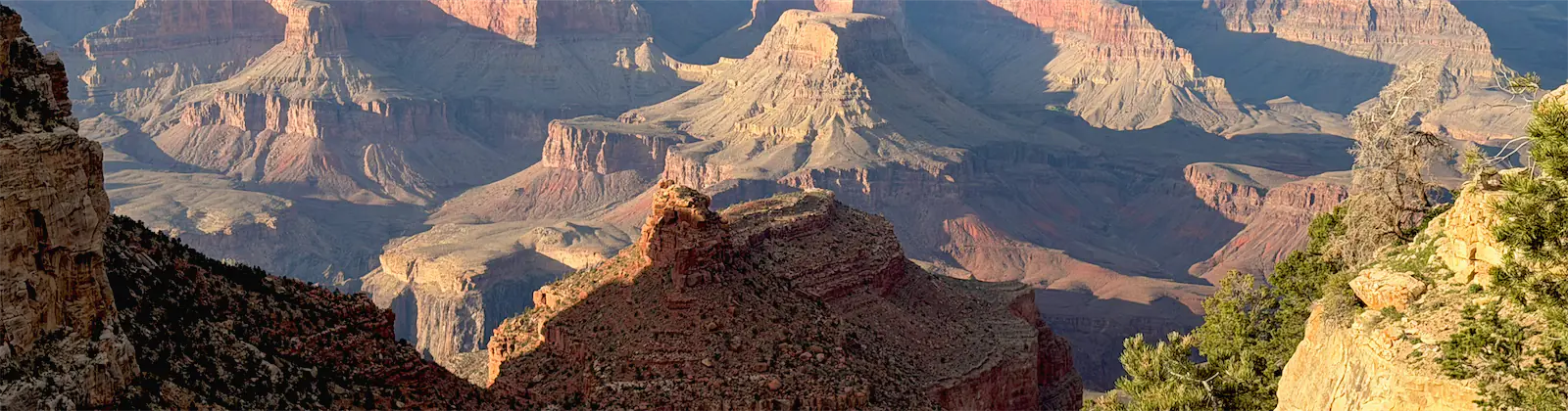 Sunlit buttes in the Grand Canyon seen from the South Rim