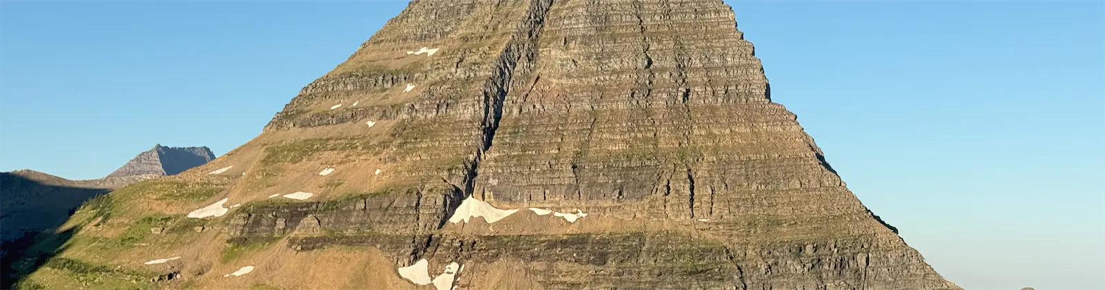 A sunlit mountain above Hidden Lake in Glacier National Park