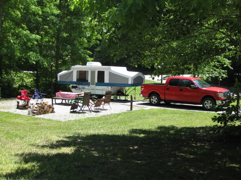 pop up camper and truck on a campsite