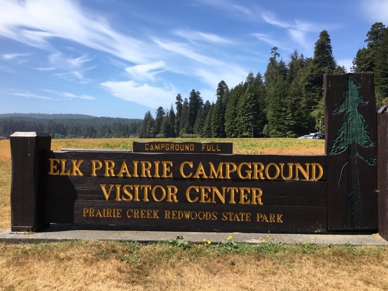 Brown and yellow park sign.