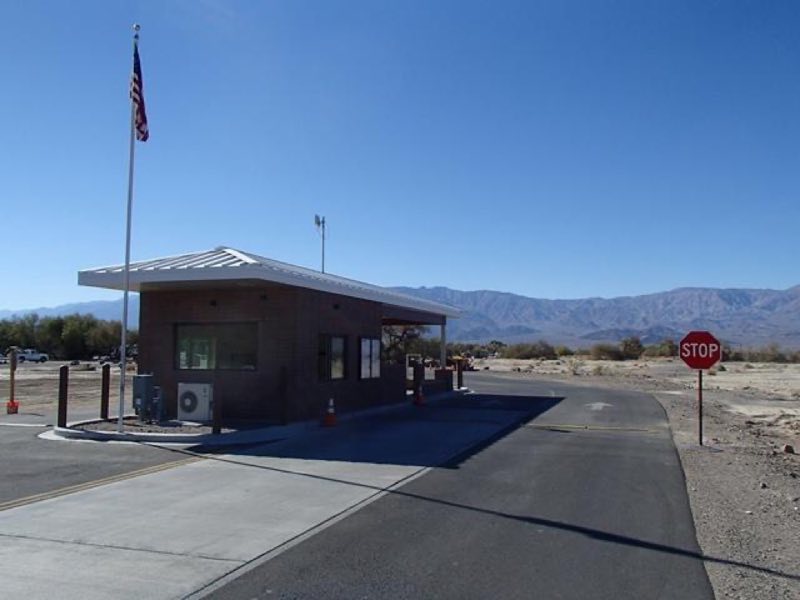 a small building with a flagpole