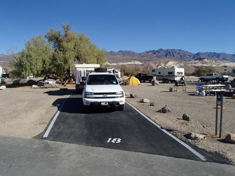a campground with trailers and tents