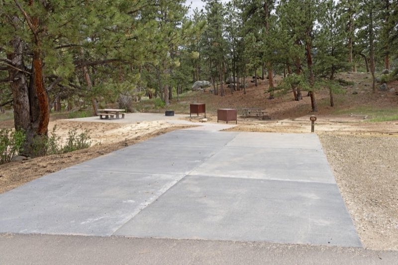 Example of a standard electric campsite with a concrete parking pad