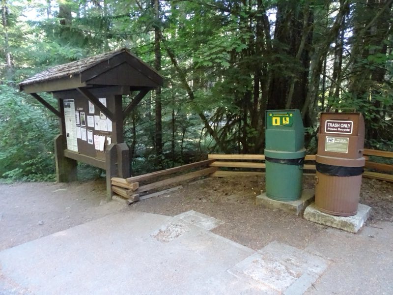 Two metal bins for recycling and trash.